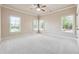 Bright bedroom with ample natural light and plush carpeting at 1655 Dawn Dr, Suwanee, GA 30024