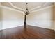Elegant dining room with hardwood floors, detailed wainscoting, and a chandelier at 1655 Dawn Dr, Suwanee, GA 30024