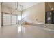 Clean, organized garage with epoxy flooring, stairs to interior, and water heater at 1655 Dawn Dr, Suwanee, GA 30024