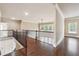 Second story hallway featuring hardwood floors and wrought iron railings at 1655 Dawn Dr, Suwanee, GA 30024