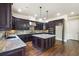 Beautiful kitchen with an island, granite countertops, and stainless appliances at 1655 Dawn Dr, Suwanee, GA 30024