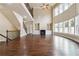 Spacious living room with fireplace, built-in shelves, and two-story windows, showcasing the open floorplan at 1655 Dawn Dr, Suwanee, GA 30024