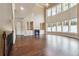 Open-concept living room featuring a fireplace, built-ins, and large windows at 1655 Dawn Dr, Suwanee, GA 30024