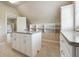 Walk-in closet with granite countertop island, custom shelves, and storage drawers at 1655 Dawn Dr, Suwanee, GA 30024