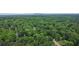 Aerial view capturing the community nestled in lush greenery, highlighting the natural beauty of the area at 5500 Georgetown Sw Trce, Lilburn, GA 30047