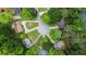 Aerial view of a lovely home situated in a serene neighborhood, surrounded by lush trees and a well-manicured cul-de-sac at 5500 Georgetown Sw Trce, Lilburn, GA 30047