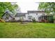 Spacious backyard with a deck, screened-in porch, and ample room for activities at 5500 Georgetown Sw Trce, Lilburn, GA 30047