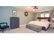 Aesthetic bedroom with soothing green walls, stylish furnishings, and ample natural light at 5500 Georgetown Sw Trce, Lilburn, GA 30047