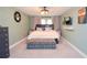 Comfortable bedroom with a soft carpet, a large bed, and elegant decor for relaxation at 5500 Georgetown Sw Trce, Lilburn, GA 30047