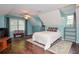 Bright bedroom with hardwood floors, a full bed, ample natural light and custom built-ins at 5500 Georgetown Sw Trce, Lilburn, GA 30047
