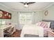 Bright bedroom boasts natural light, hardwood floors, and comfortable furniture at 5500 Georgetown Sw Trce, Lilburn, GA 30047