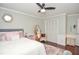 Bright bedroom boasts natural light, hardwood floors, and comfortable furniture at 5500 Georgetown Sw Trce, Lilburn, GA 30047