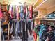 Well-organized walk-in closet with ample storage, clothing racks, and shelves for shoes and accessories at 5500 Georgetown Sw Trce, Lilburn, GA 30047