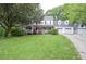 Charming two-story home with a large front porch and well-manicured lawn at 5500 Georgetown Sw Trce, Lilburn, GA 30047