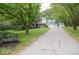 Charming home featuring a long driveway leading to a two-car garage, complemented by a well-manicured front lawn at 5500 Georgetown Sw Trce, Lilburn, GA 30047