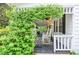Charming front porch featuring rocking chairs and decorative greenery at 5500 Georgetown Sw Trce, Lilburn, GA 30047