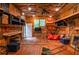 Spacious garage with wooden floors, shelving, and natural light at 5500 Georgetown Sw Trce, Lilburn, GA 30047