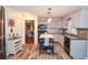 Well-lit kitchen with wood-look floors, grey cabinets, and stainless steel appliances at 5500 Georgetown Sw Trce, Lilburn, GA 30047