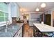 Bright kitchen with stainless steel appliances, granite countertops, and modern fixtures at 5500 Georgetown Sw Trce, Lilburn, GA 30047