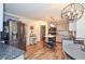 Modern kitchen featuring stainless steel appliances, an island, and wood-look flooring at 5500 Georgetown Sw Trce, Lilburn, GA 30047