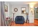 Cozy reading area with hardwood floors, a comfortable armchair, and elegant decor at 5500 Georgetown Sw Trce, Lilburn, GA 30047