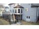 Backyard features a deck, screened porch, and stairs leading to the yard with room to entertain at 1185 Whitehawk Trl, Lawrenceville, GA 30043