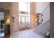 Bright foyer features tile flooring, high ceilings, and a staircase to the upper level at 1185 Whitehawk Trl, Lawrenceville, GA 30043