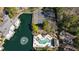 Aerial view showcasing a beautiful community pool, tennis courts, and lush landscaping at 303 Mill Pond Se Ct, Smyrna, GA 30082