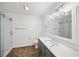 Updated bathroom features quartz countertop, modern vanity, and glass-enclosed shower at 303 Mill Pond Se Ct, Smyrna, GA 30082