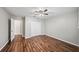 Bedroom with hardwood floors, ceiling fan, and a spacious closet at 303 Mill Pond Se Ct, Smyrna, GA 30082