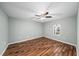 Light and airy bedroom featuring beautiful wood floors and a ceiling fan at 303 Mill Pond Se Ct, Smyrna, GA 30082