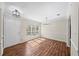 Bright dining room featuring hardwood floors, large windows, and elegant lighting fixtures at 303 Mill Pond Se Ct, Smyrna, GA 30082
