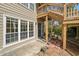 Picturesque view of the exterior, with a lovely entrance with black door and potted plants at 303 Mill Pond Se Ct, Smyrna, GA 30082