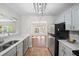 Stylish eat-in kitchen featuring stainless steel appliances, updated fixtures, and lots of natural light at 303 Mill Pond Se Ct, Smyrna, GA 30082