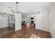 Bright and open living space featuring hardwood floors and seamless access to the kitchen and living room at 303 Mill Pond Se Ct, Smyrna, GA 30082