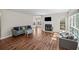 Spacious living room with hardwood floors, fireplace, and large windows at 303 Mill Pond Se Ct, Smyrna, GA 30082
