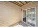 Private outdoor patio with sliding glass doors to the interior at 303 Mill Pond Se Ct, Smyrna, GA 30082