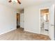 Bedroom with neutral carpet and an open door leading to an en-suite bathroom at 3588 Swallow Ln, Decatur, GA 30032