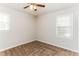 Comfortable bedroom with neutral walls, natural light, a ceiling fan, and carpeted floors at 3588 Swallow Ln, Decatur, GA 30032