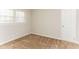 Neutral bedroom with soft carpet, natural light from a window, and a paneled wall at 3588 Swallow Ln, Decatur, GA 30032