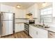 Well-equipped kitchen featuring white cabinets, stainless steel appliances, and granite countertops at 3588 Swallow Ln, Decatur, GA 30032
