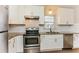 Modern kitchen with white cabinets, stainless steel appliances, granite counters, and subway tile backsplash at 3588 Swallow Ln, Decatur, GA 30032