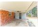 Covered patio featuring brick and siding with a ceiling fan at 3588 Swallow Ln, Decatur, GA 30032