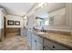Bathroom with granite countertops, dual sinks, and decorative tile backsplash at 111 Carter Ln, Canton, GA 30115