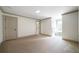 Bedroom with beige carpet, neutral paint, white trim and molding, and a window nook with natural light at 111 Carter Ln, Canton, GA 30115