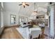 Open-concept living area boasts natural light, wood floors, and neutral decor at 111 Carter Ln, Canton, GA 30115