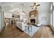 Bright living room with a cozy fireplace, hardwood floors, and large windows at 111 Carter Ln, Canton, GA 30115