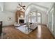 Spacious living room features a brick fireplace, hardwood floors, and cathedral ceilings at 111 Carter Ln, Canton, GA 30115