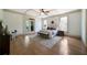 Serene bedroom with tray ceilings, french doors, hardwood floors, and a seating area at 111 Carter Ln, Canton, GA 30115