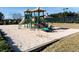 Community playground with a slide, climbing structures, and a soft sand surface for safety at 111 Carter Ln, Canton, GA 30115